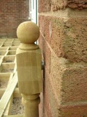 fix newel post to wall